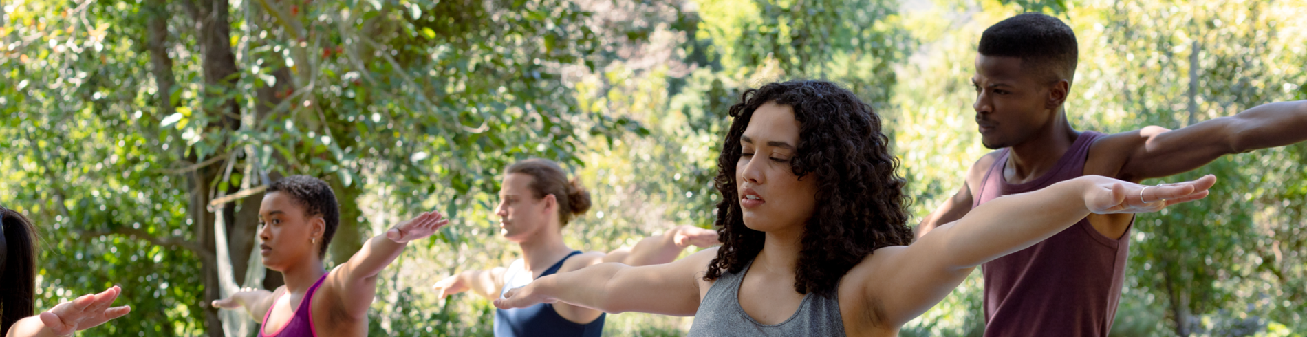 Group of people doing yoga outside