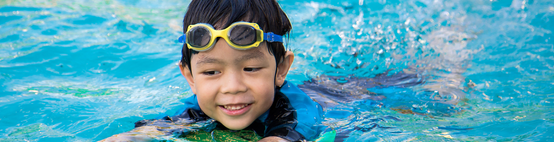 Child swimming in pool