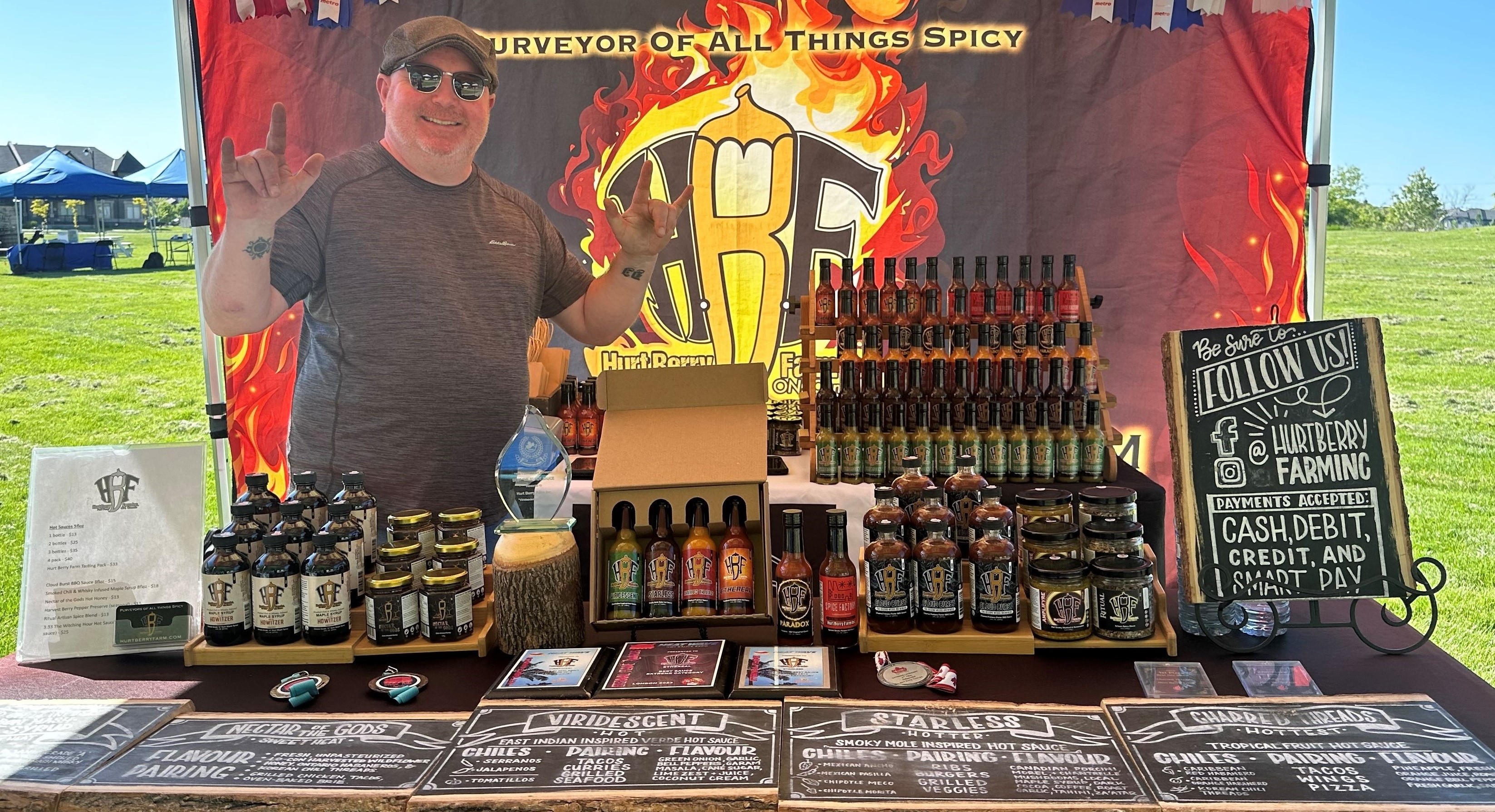 Vendor at the market selling hot sauce