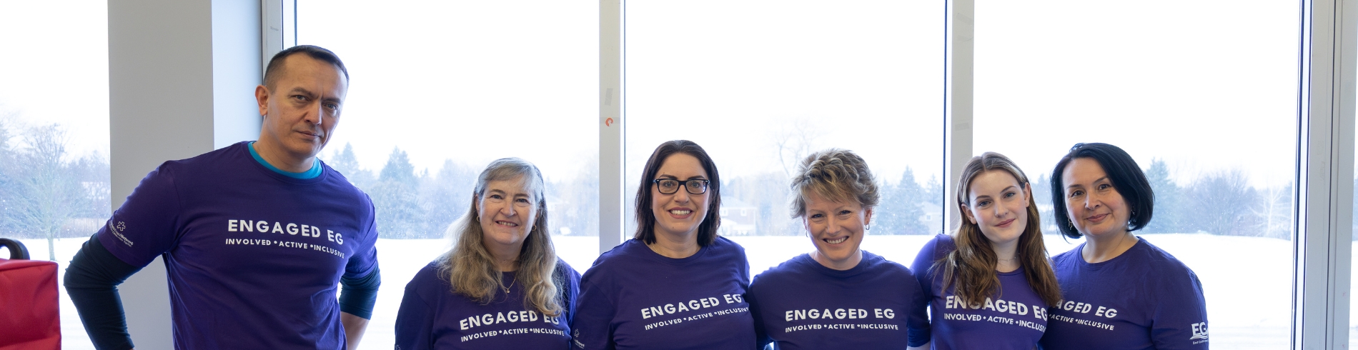 Engaged EG group in purple shirts that says Engaged EG